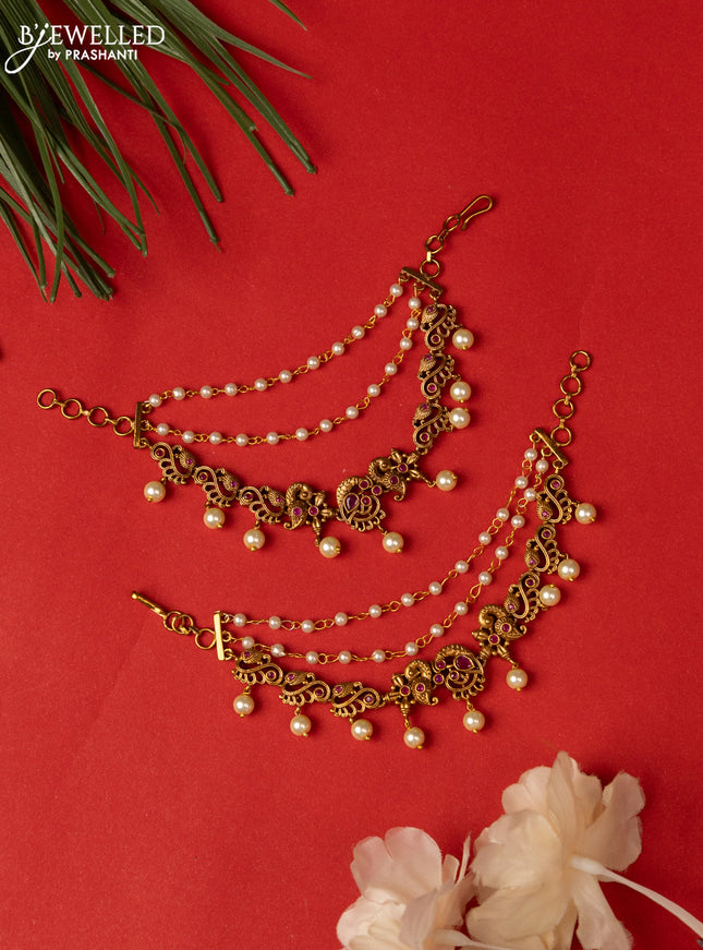 Antique triple layer mattal peacock design with pink kemp stones and pearl hangings