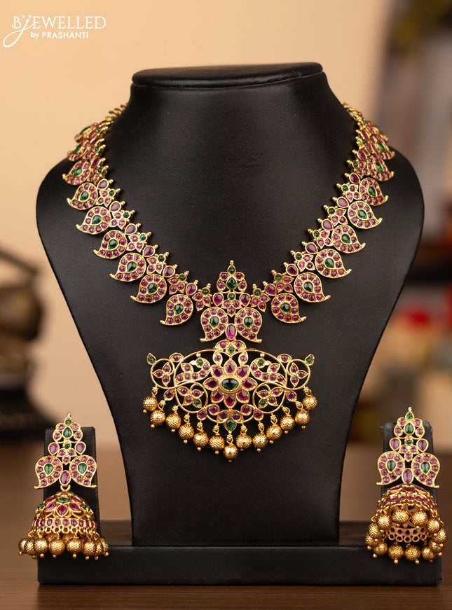 Antique necklace manga pattern with kemp stones and golden beads hanging