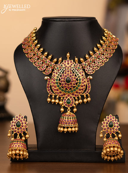 Antique necklace manga pattern with kemp stones and golden beads hanging