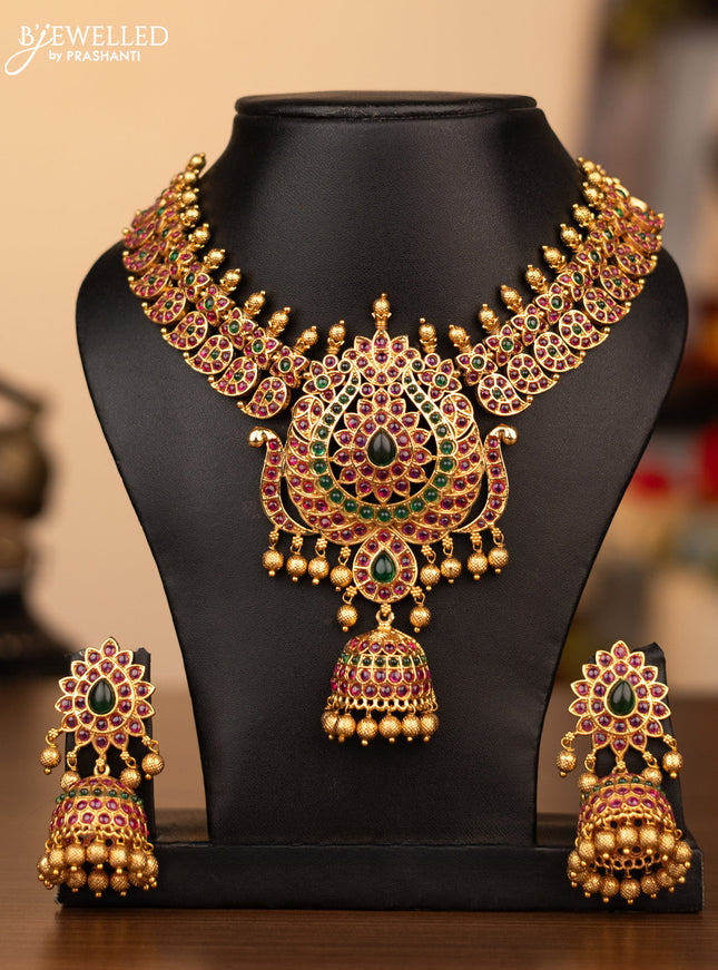 Antique necklace manga pattern with kemp stones and golden beads hanging