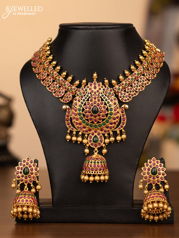 Antique necklace manga pattern with kemp stones and golden beads hanging