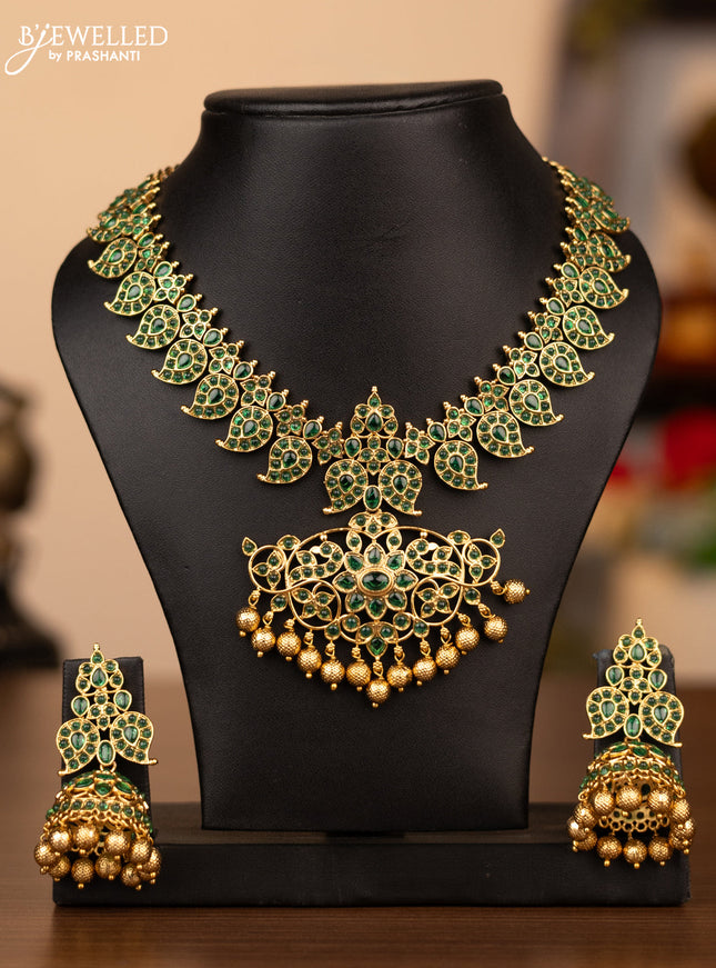 Antique necklace manga pattern with green kemp stones and golden beads hanging