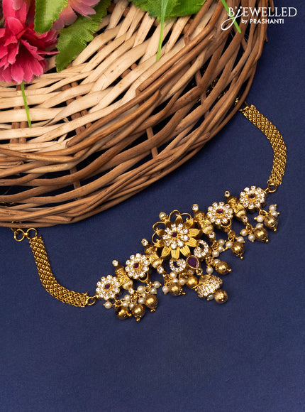 Antique choker floral design with pink kemp & cz stones and pearl & golden beads hanging without earrings