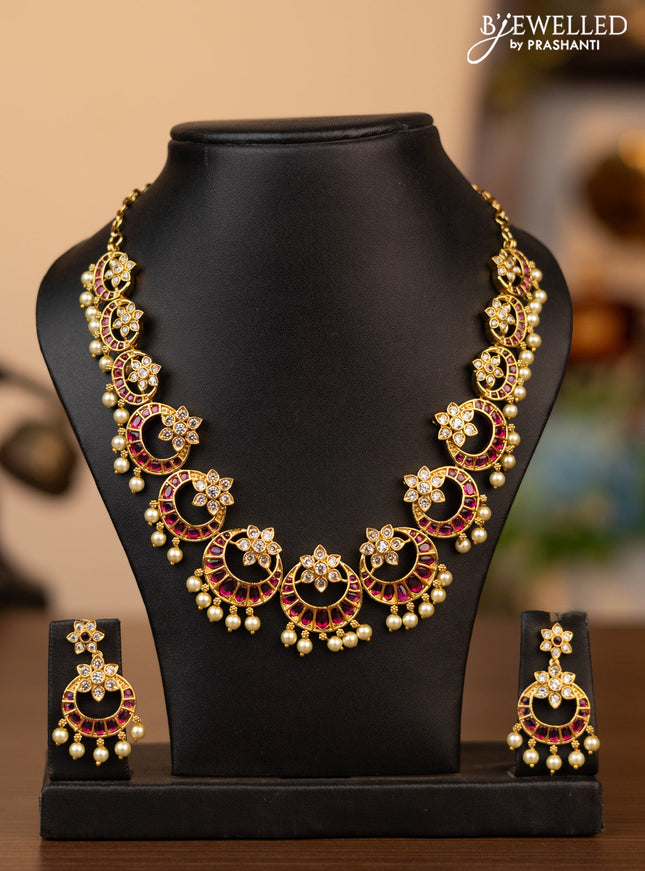 Antique necklace chandbali design with pink kemp & cz stones and pearl hangings