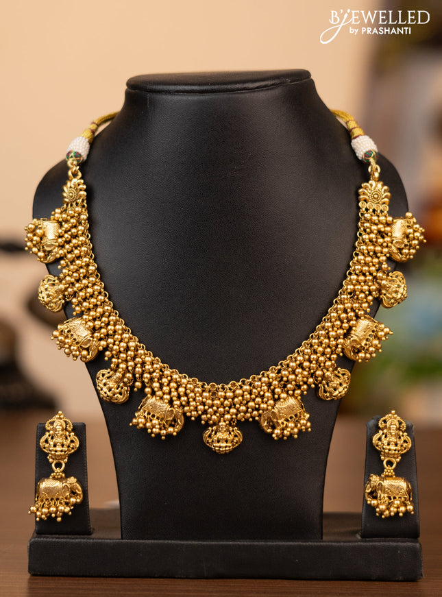 Antique necklace with lakshmi & elephant design and golden beads hanging