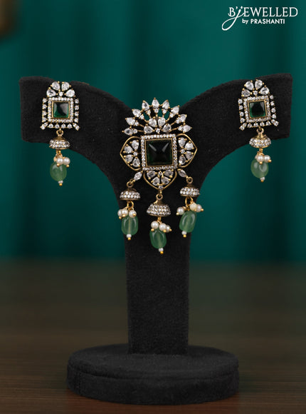 Victorian finish pendant set with emerald & cz stone and green beads hangings