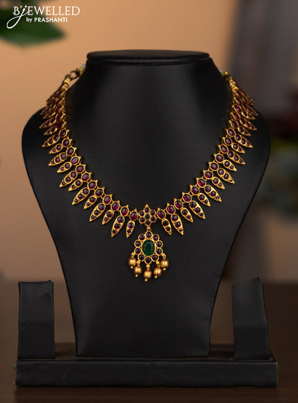 Antique necklace with kemp stones and goldden beads hanging without earrings