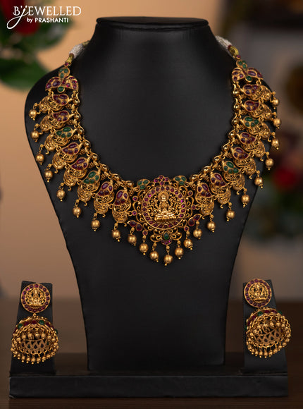Antique necklace lakshmi design with kemp stones and golden beads hanging