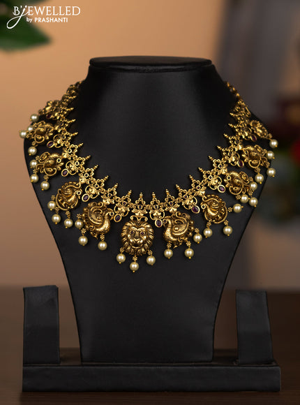 Antique necklace peacock design with pink kemp stones and pearl hangings without earrings