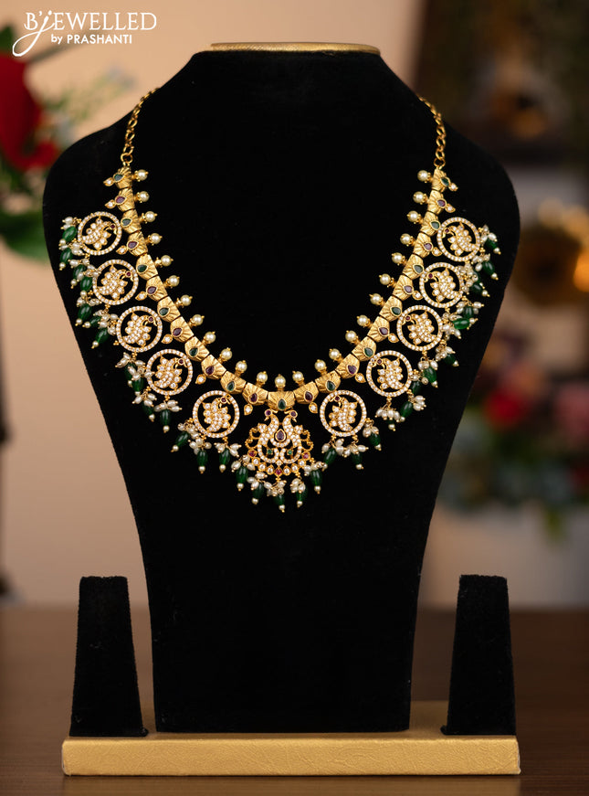 Antique necklace peacock design with kemp & cz stones and pearl & green beads hanging without earrings
