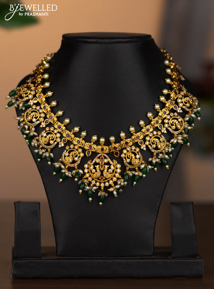 Antique necklace peacock design with kemp & cz stones and pearl & green beads hanging without earrings