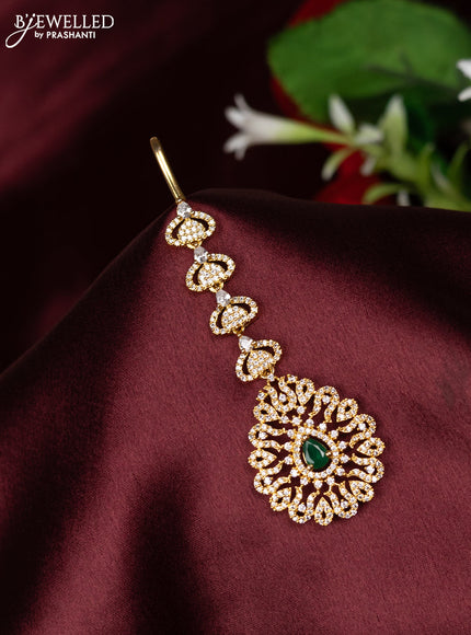 Zircon maang tikka with emerald and cz stones in gold finish