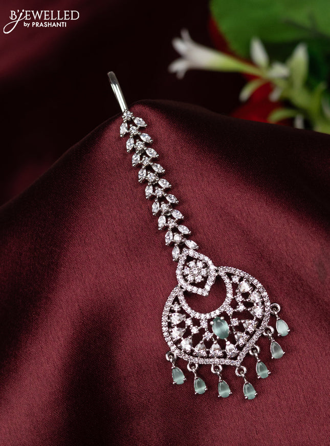 Zircon maang tikka with mint green & cz stones and hangings