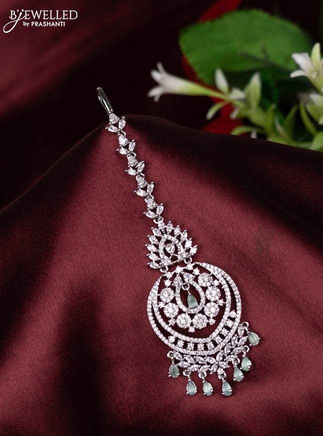 Zircon maang tikka with mint green & cz stones and hangings