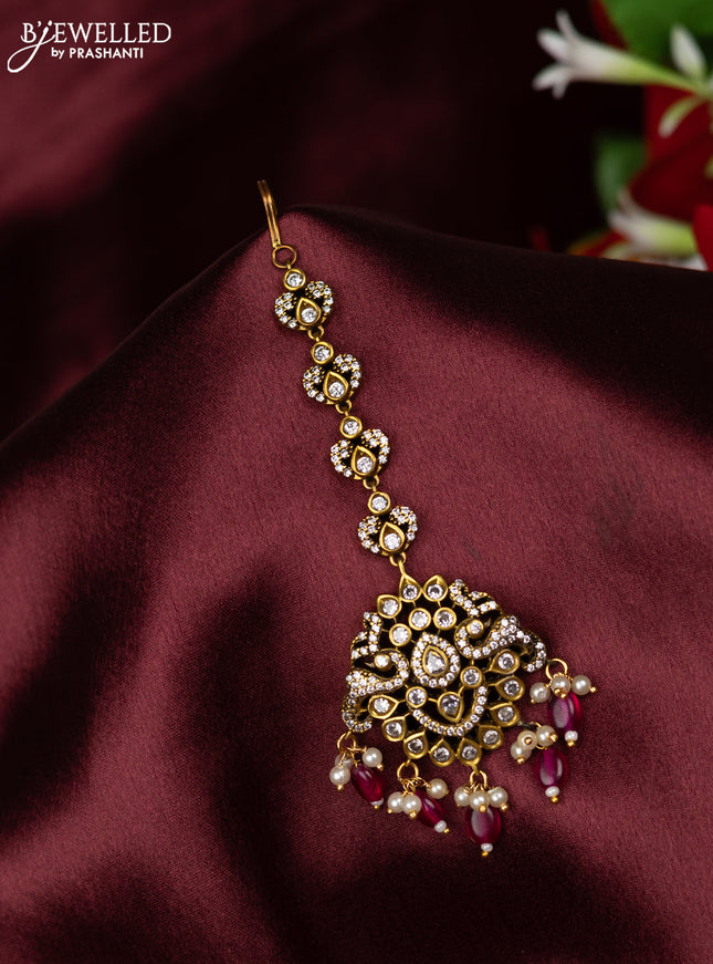 Maang Tikka with cz stones and pink beads hanging in victorian finish