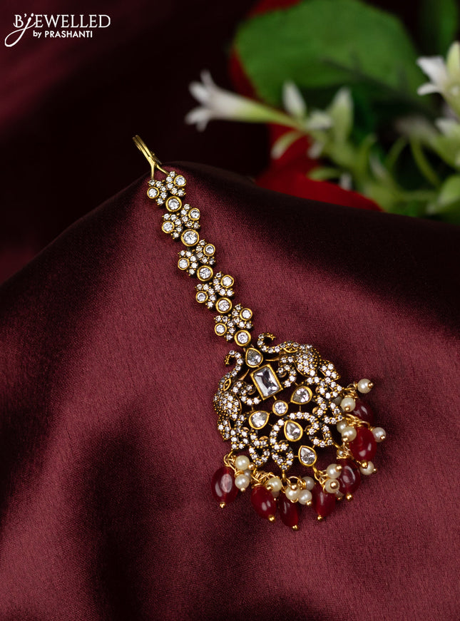 Maang Tikka with cz stones and pink beads hanging in victorian finish