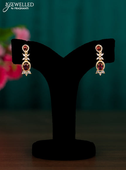 Zircon earrings with ruby and cz stones in golden finish
