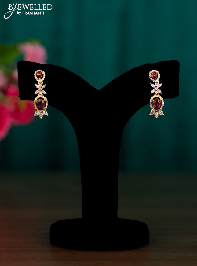 Zircon earrings with ruby and cz stones in golden finish