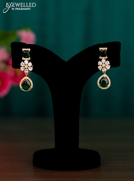 Zircon floral design earrings with emerald and cz stones in gold finish