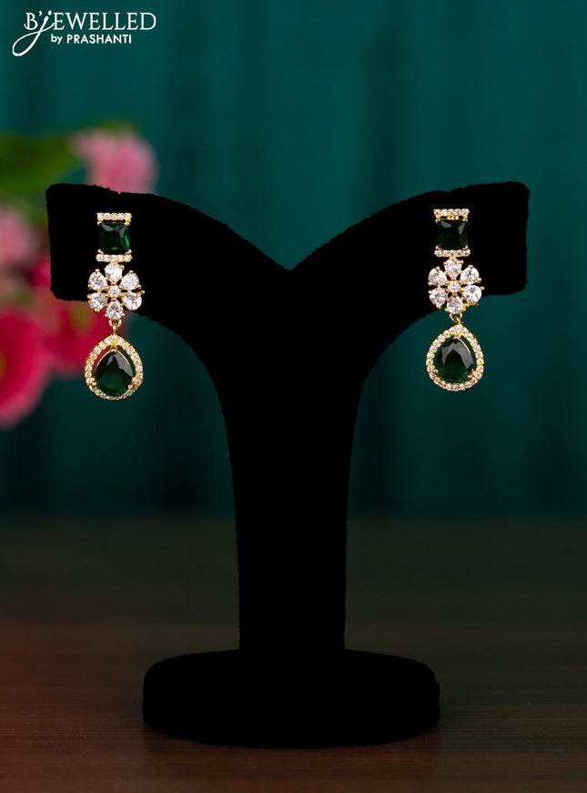 Zircon floral design earrings with emerald and cz stones in gold finish