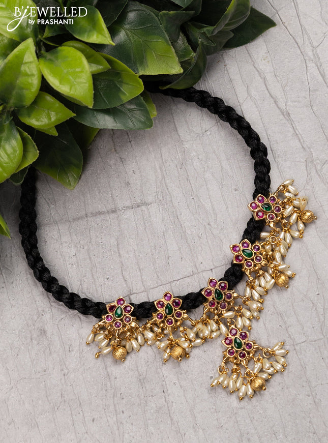 Black thread necklace with kemp stone and pearl hangings without earrings