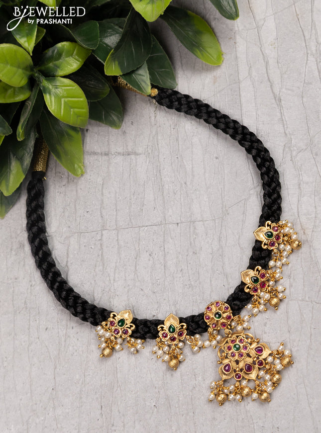 Black thread necklace with kemp stone and pearl hangings without earrings