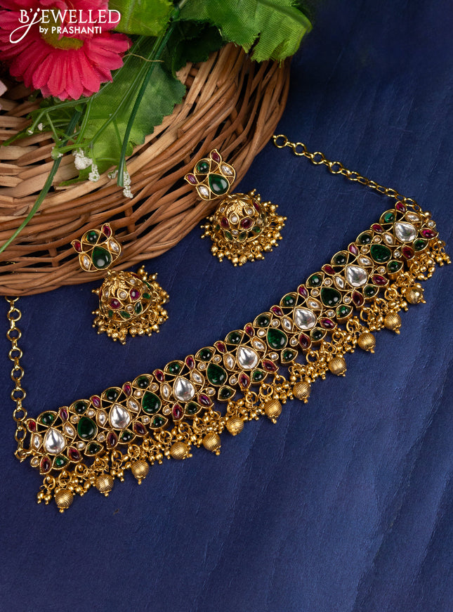 Antique choker with jadau kundan stones and golden beads hanging