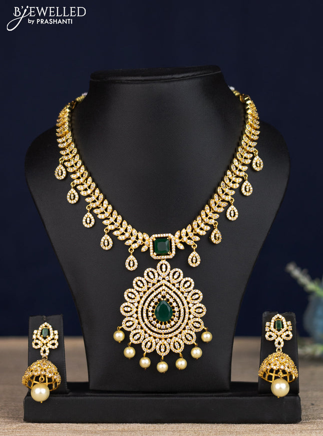 Zircon necklace with emerald & cz stones and pearl hangings in gold finish