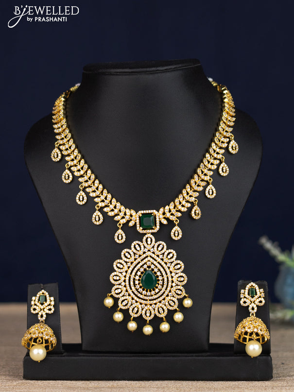 Zircon necklace with emerald & cz stones and pearl hangings in gold finish