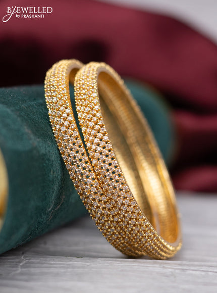 Zircon bangle with cz stones in gold finish