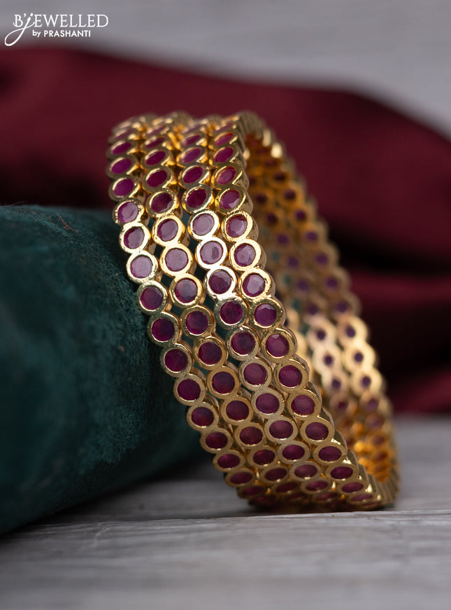 zircon bangle with ruby and  cz stones in gold finish