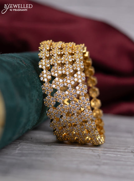 Zircon bangle with cz stones in gold finish