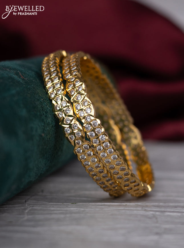Zircon bangle with cz stones in gold finish