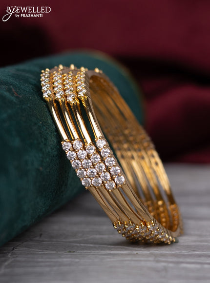 Zircon bangle with cz stones in gold finish