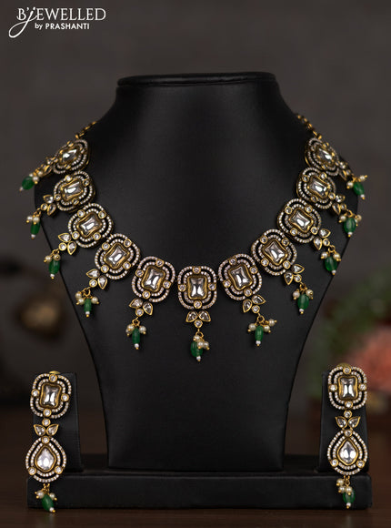 Necklace with emerald & cz stones and beads hangings in victorian finish