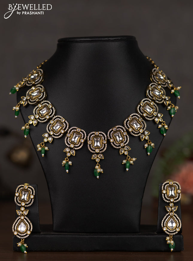 Necklace with emerald & cz stones and beads hangings in victorian finish
