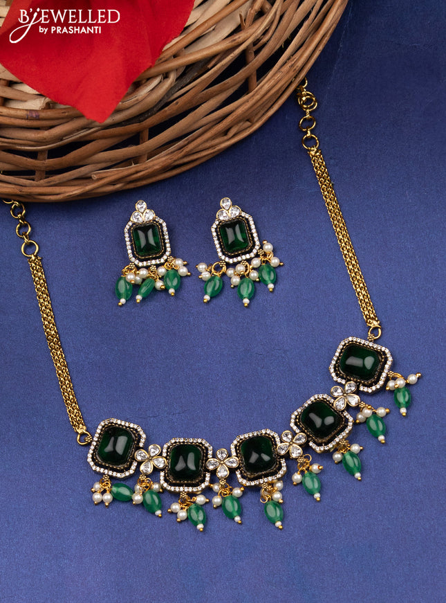 Victorian finish choker with emerald & kundan stones and beads hanging