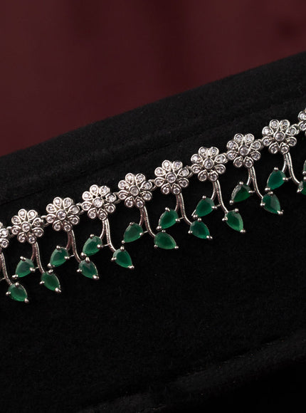 Zircon hip chain with floral design and emerald & cz stones