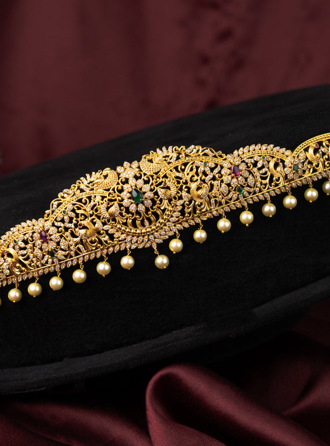 Zircon hip chain peacock design with kemp & cz stones and pearl hangings in gold finish