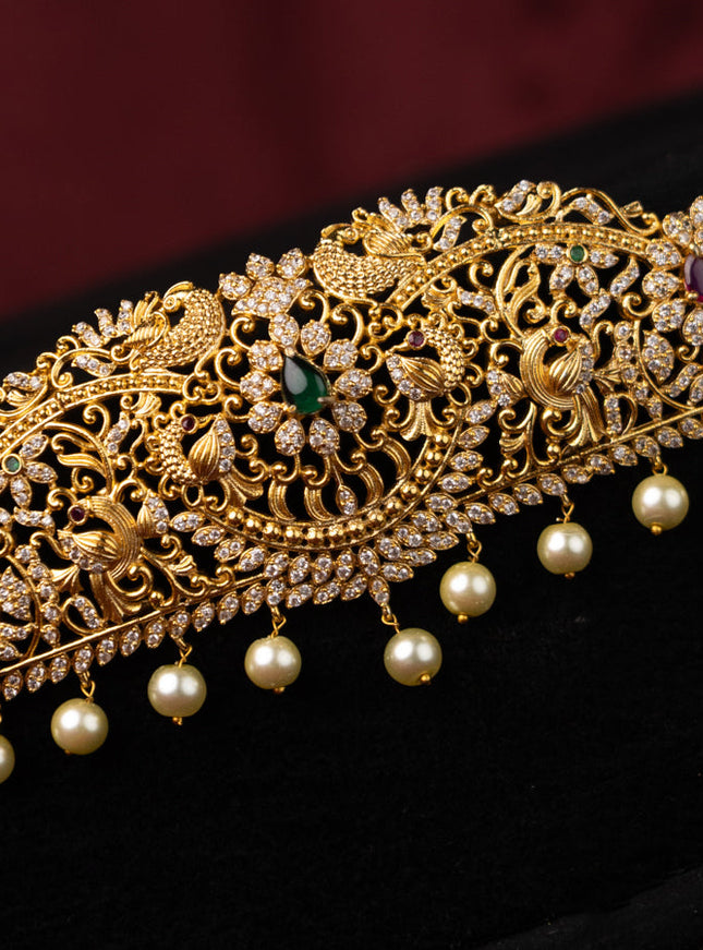 Zircon hip chain peacock design with kemp & cz stones and pearl hangings in gold finish