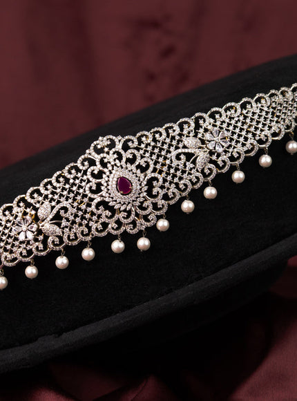 Zircon hip chain with ruby & cz stones and pearl hangings in gold finish