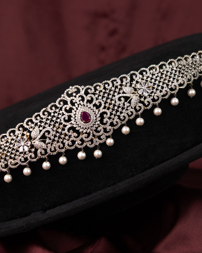 Zircon hip chain with ruby & cz stones and pearl hangings in gold finish