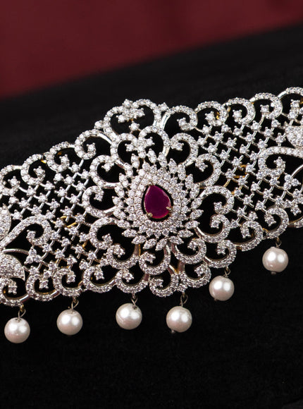 Zircon hip chain with ruby & cz stones and pearl hangings in gold finish