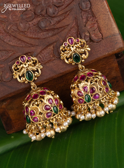Antique jhumka peacock design with kemp stones and pearl hangings