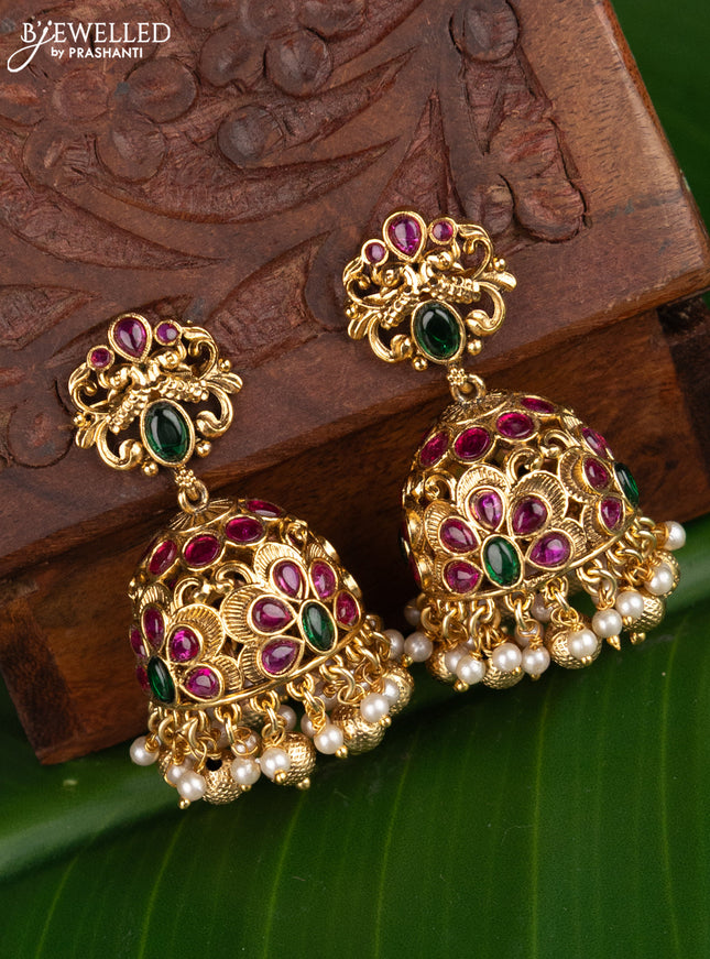 Antique jhumka peacock design with kemp stones and pearl hangings