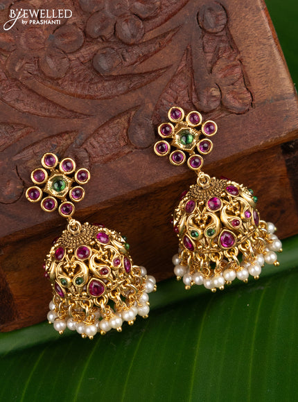 Antique jhumka peacock design with kemp stones and pearl hangings