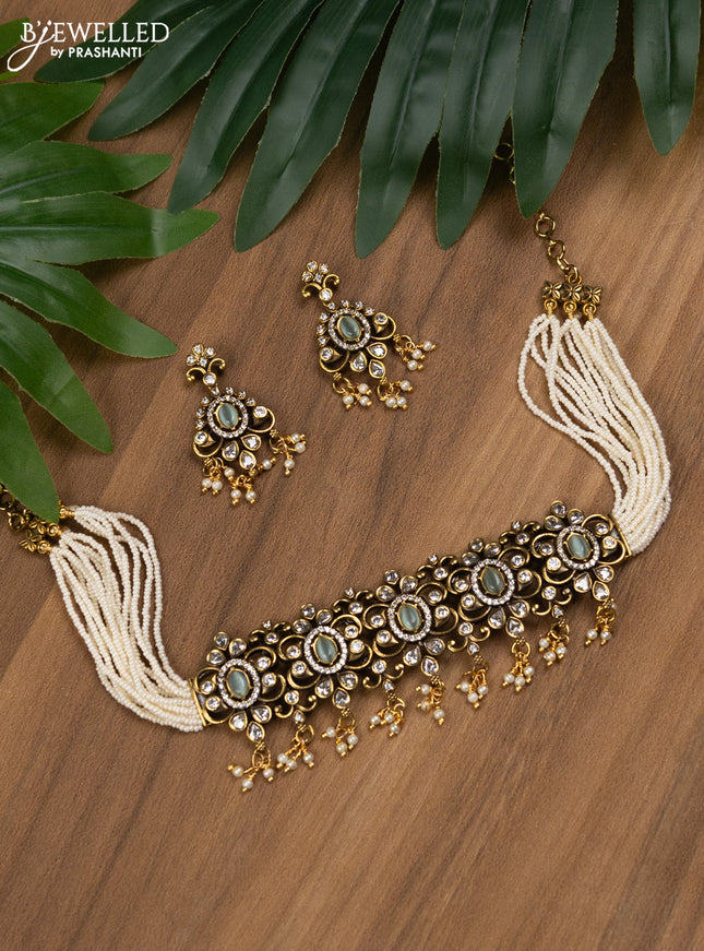 Pearl choker with mint green and cz stones