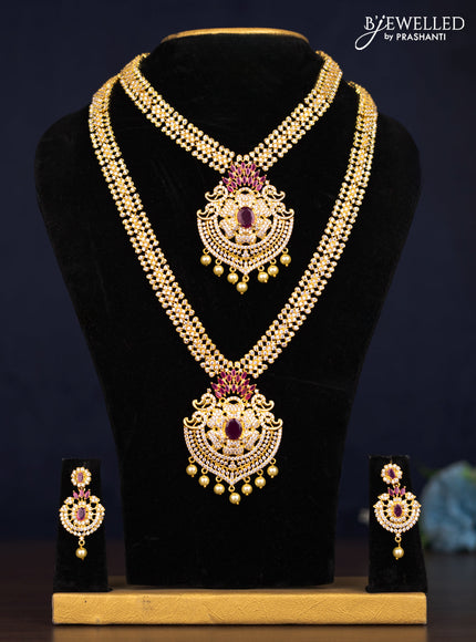 Zircon combo set floral design with ruby & cz stones and pearl hangings in golden finish