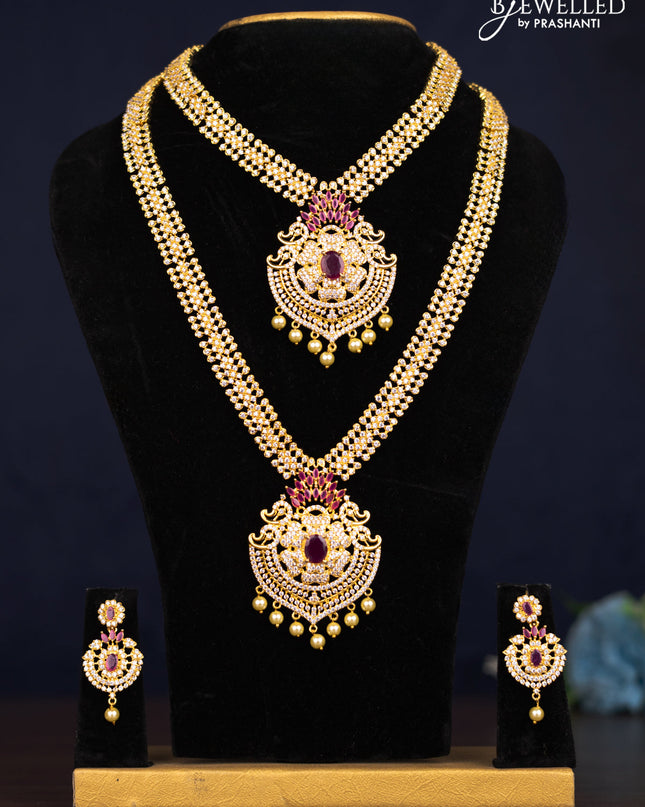 Zircon combo set floral design with ruby & cz stones and pearl hangings in golden finish