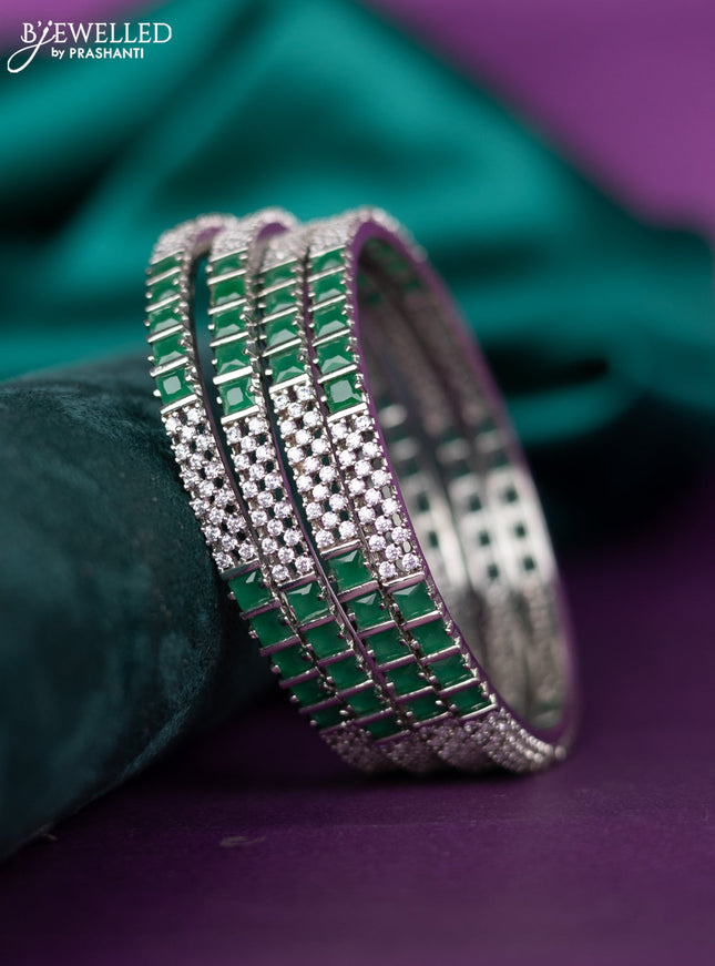 zircon bangle with emerald and cz stones